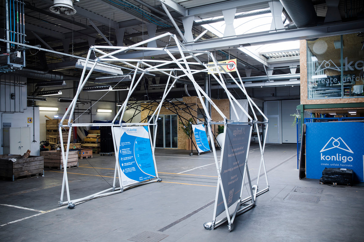 Konligo Arko400 foldable event structure with white frame and printed banners displayed indoors at Konligo headquarters, now available on MTN SHOP US.