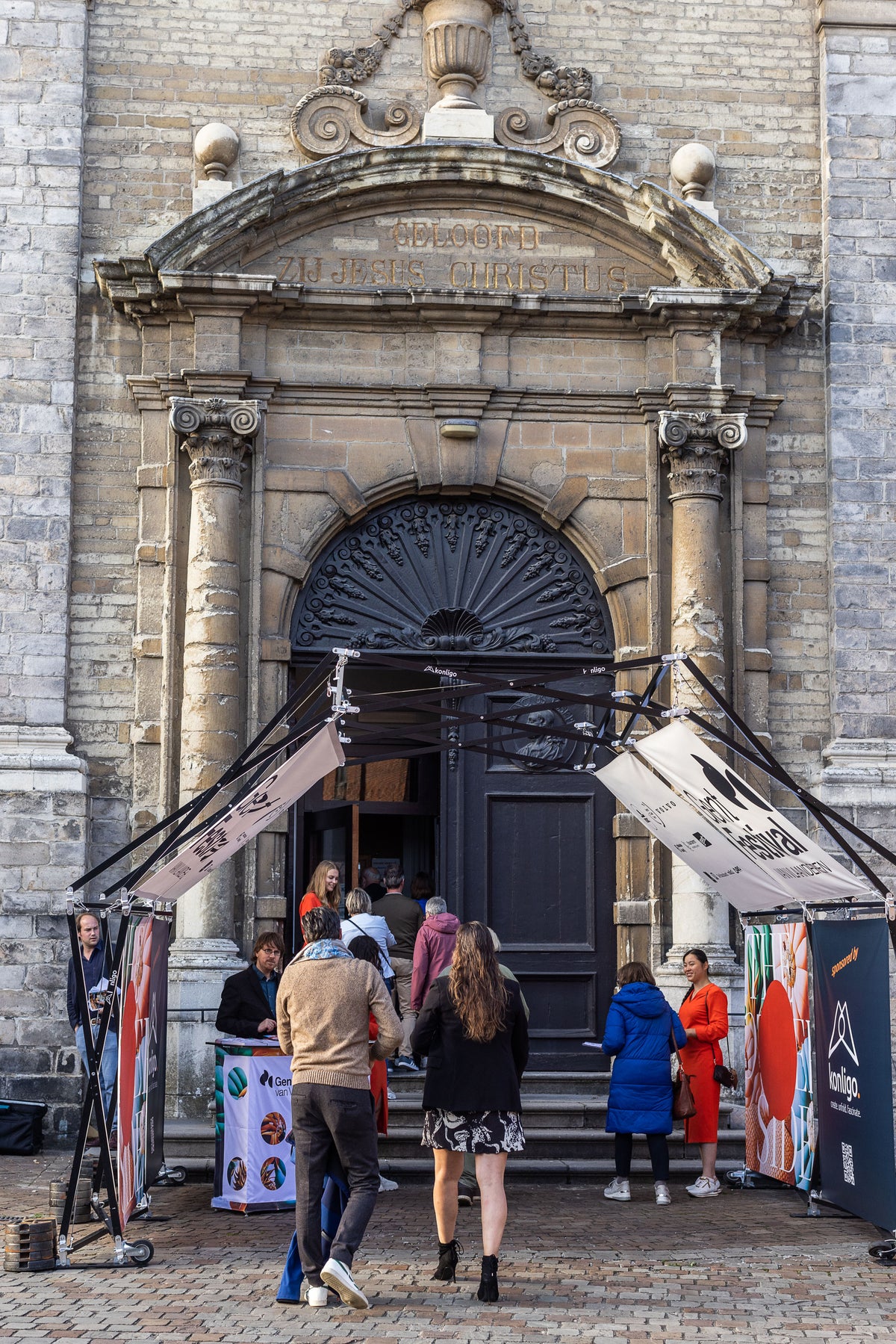 Konligo Arko470 foldable event structure with printed banners set up at the entrance of a historic building for a public event, now available on MTN SHOP US.