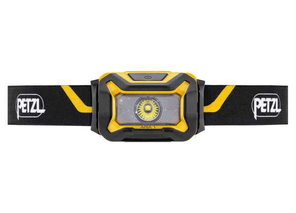 Compact Petzl Aria 1 headlamp with adjustable strap.
