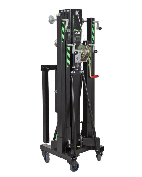 Kuzar Tower Lift K30– Weighing only 103kg the K-30 is capable of lifting 200kg to a height of 5m. The K-30 is a multipurpose tower for the elevation of Audio Systems, Line Array, truss structures, lighting systems, etc. The K-30 lifting tower is the lightest in the range. It is composed of 4 aluminum sections and a steel base provides stability, it comes with two extra lateral supports to provide more muscle when lifting P.A. In addition to four adjustable legs with non-slip rubber saucers. The 4 swivel whe - imagen 2